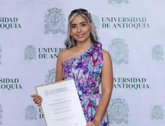 Ana María with her Master's in Education diploma