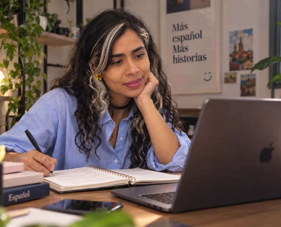 Ana María preparing a personalized online Spanish class at her laptop