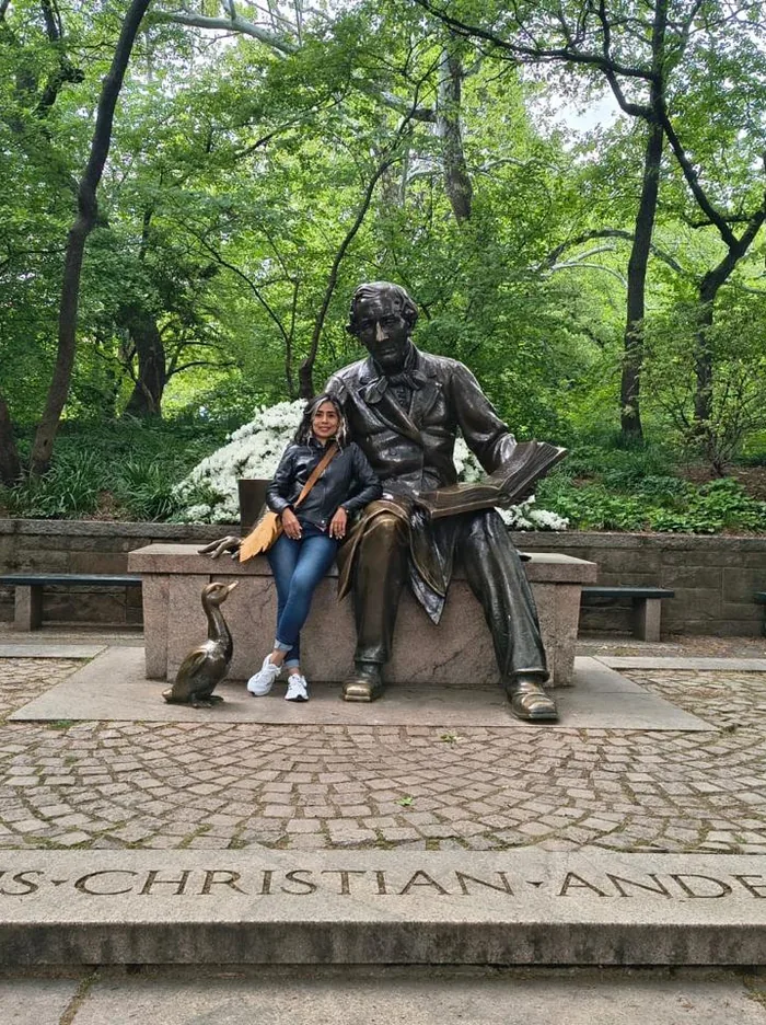 Spanish student sitting by the Hans Christian Andersen statue in Central Park